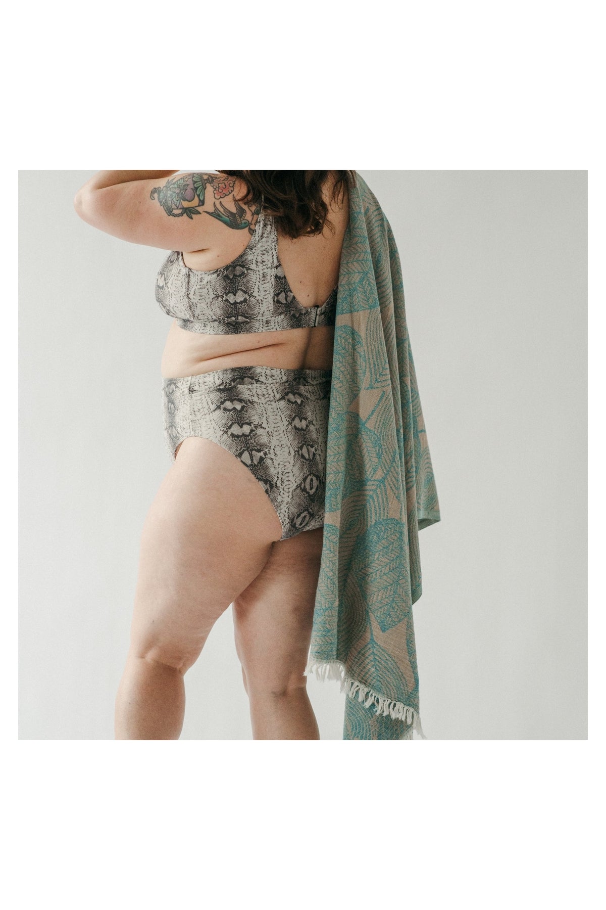 Pokoloko Leaf Appliqué Turkish cotton towel in teal and natural with botanical jacquard pattern