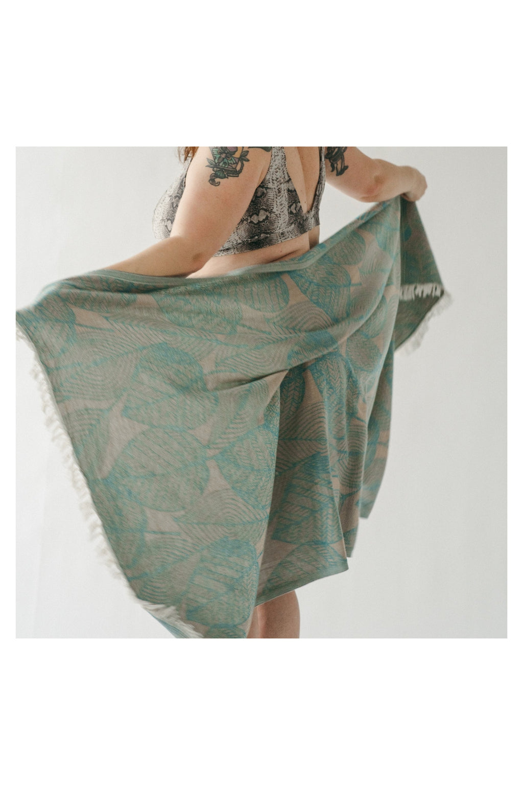 Pokoloko Leaf Appliqué Turkish cotton towel in teal and natural with botanical jacquard pattern