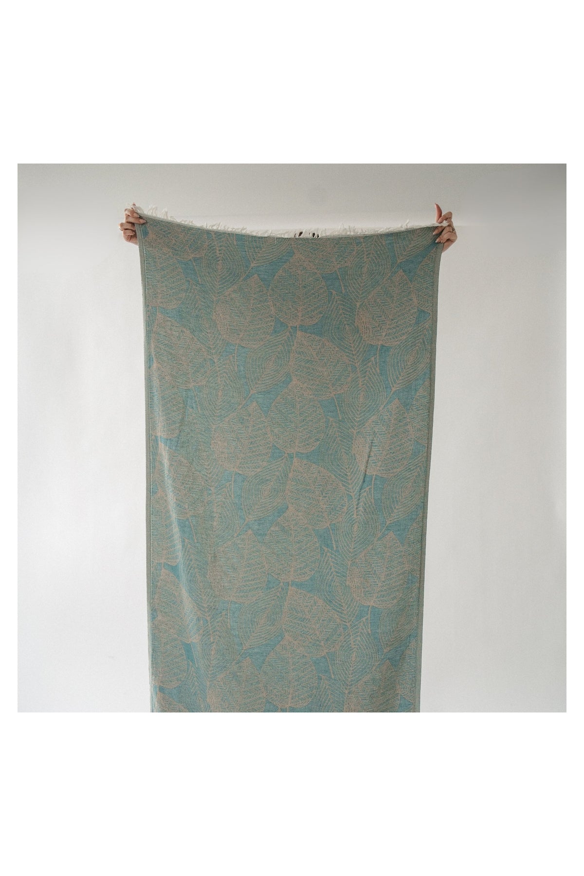 Pokoloko Leaf Appliqué Turkish cotton towel in teal and natural with botanical jacquard pattern