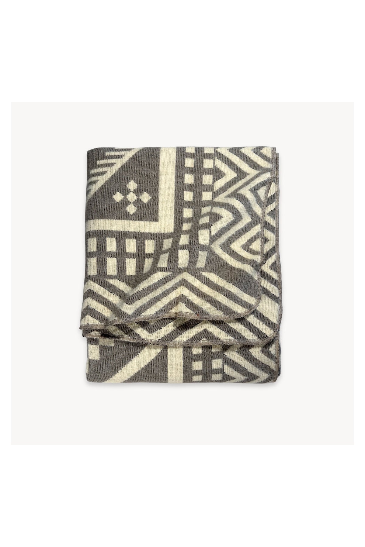 Pokoloko Southwest throw blanket in Etching with reversible geometric pattern