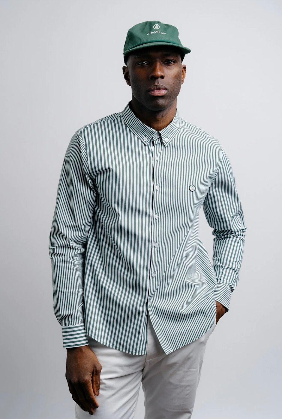 Champlain Stripe Dress Shirt in green, featuring classic striped pattern, refined fit, and premium craftsmanship. Versatile design perfect for both office and casual wear.