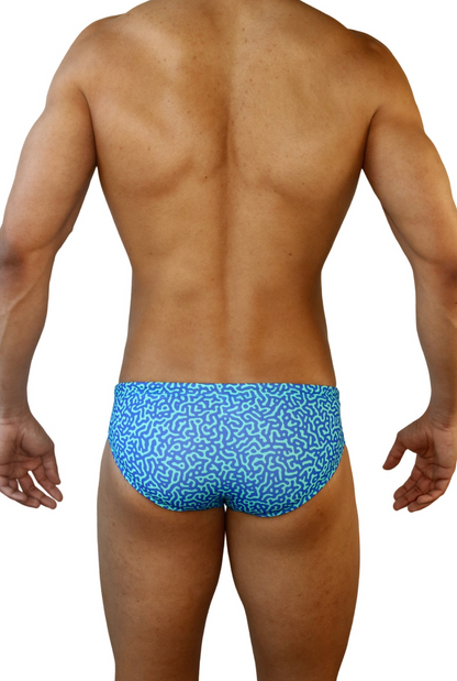 Back view of snug-fitting HAC Swim Brief in bold blue and fun pattern
