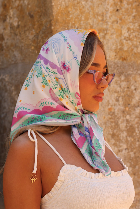 Model wearing Kulani Kinis Pretty Primrose bandana - Close-up of fabric texture and Pretty Primrose flower detailing 