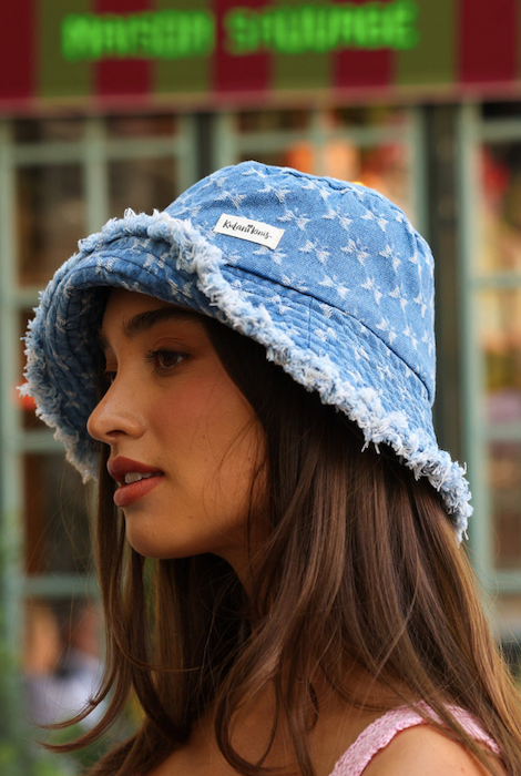 Side angle showing raw frayed edge and denim texture