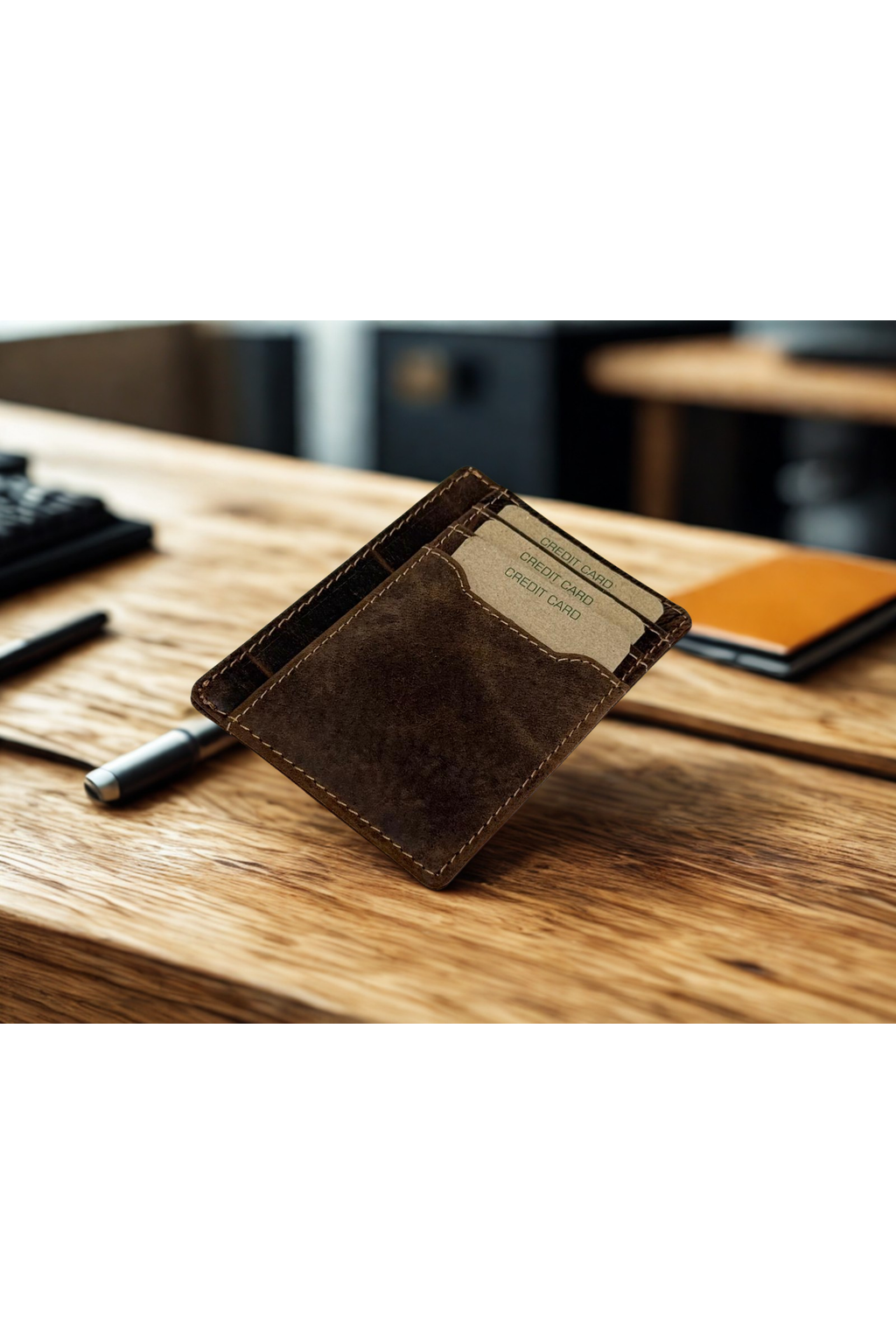 Greenwood Leather Slim Card Case in Sandal — on a desk with cards
