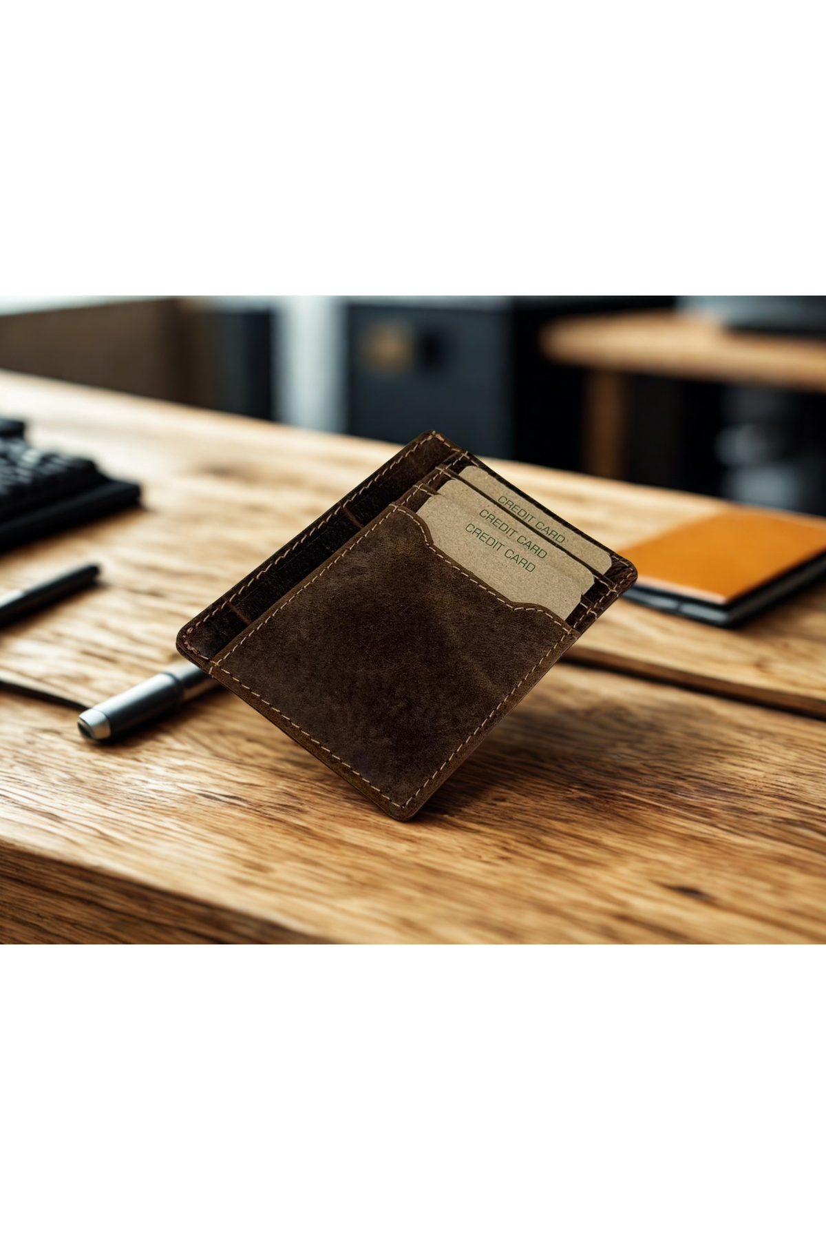 Greenwood Leather Slim Card Case in Sandal — on a desk with cards