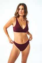 Huha High Rise Bikini underwear in Merlot burgundy, high-cut leg and high-rise waist on a model