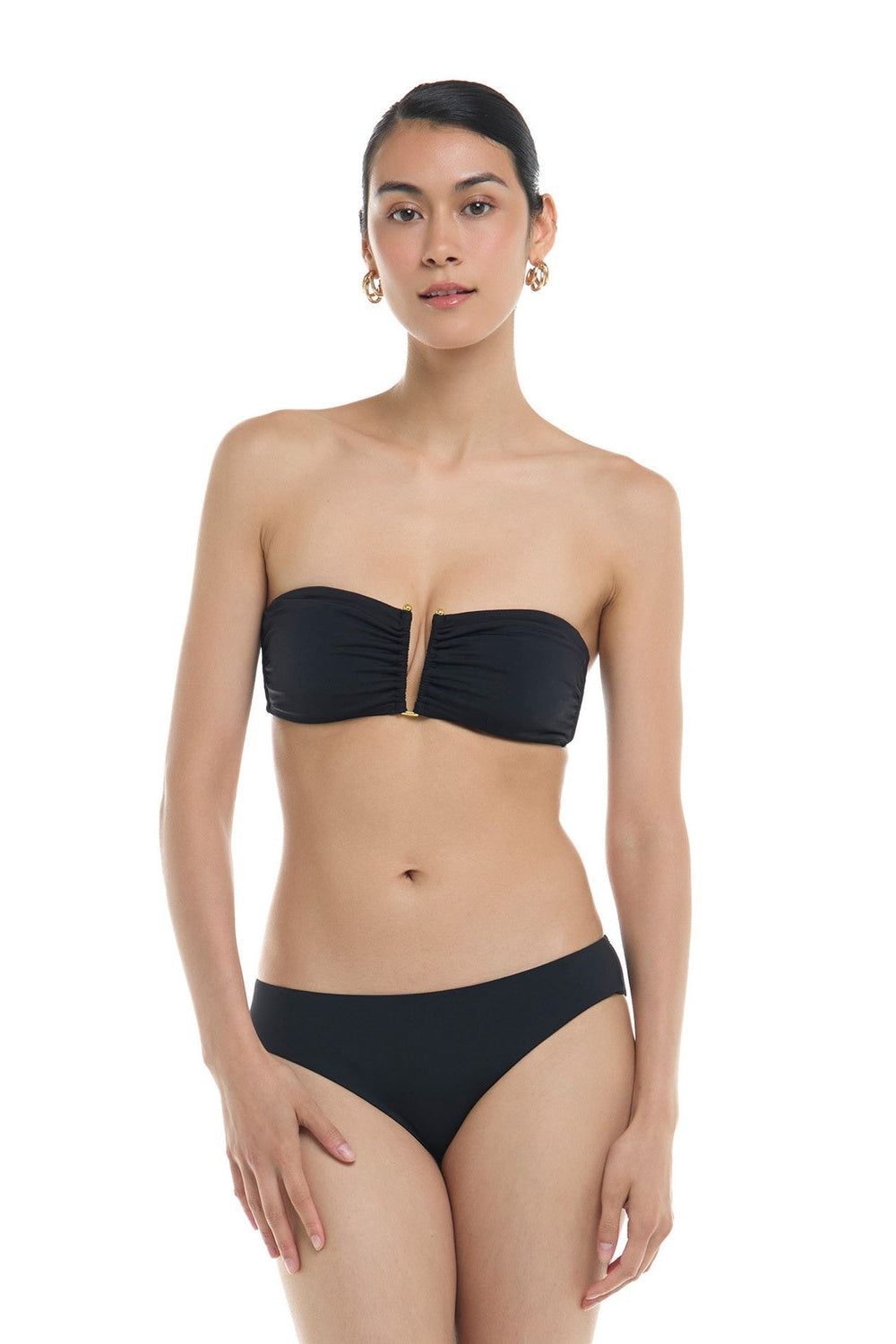 Skye Solids Leslie Bandeau Bikini Top in black on a model, front view