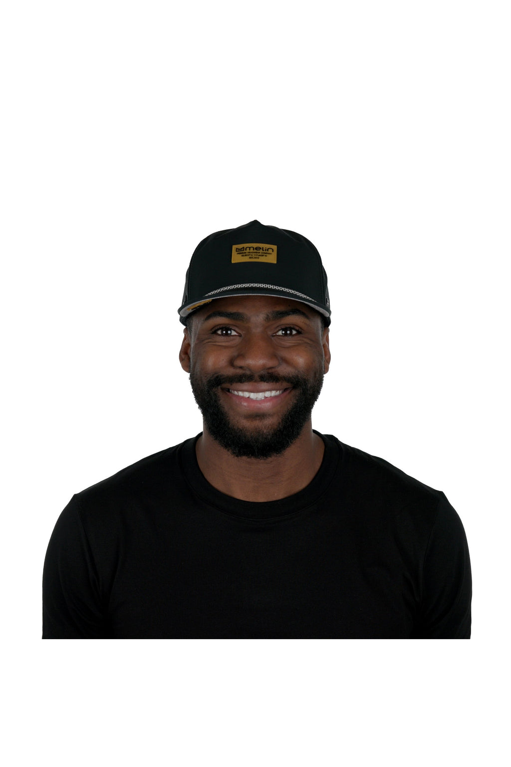 Model wearing the melin Coronado Brick Hydro performance snapback hat in Black/Gum