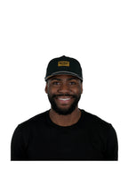 Model wearing the melin Coronado Brick Hydro performance snapback hat in Black/Gum