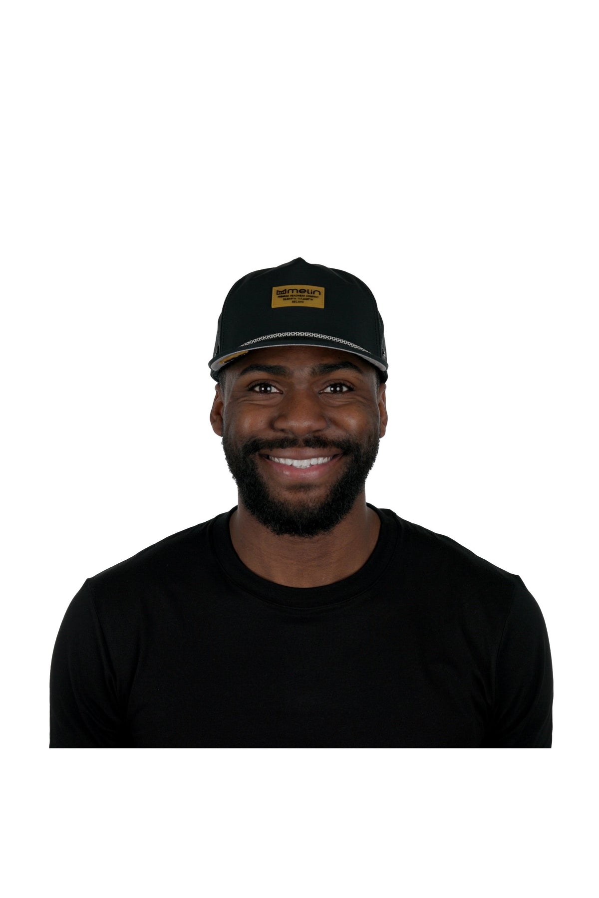 Model wearing the melin Coronado Brick Hydro performance snapback hat in Black/Gum