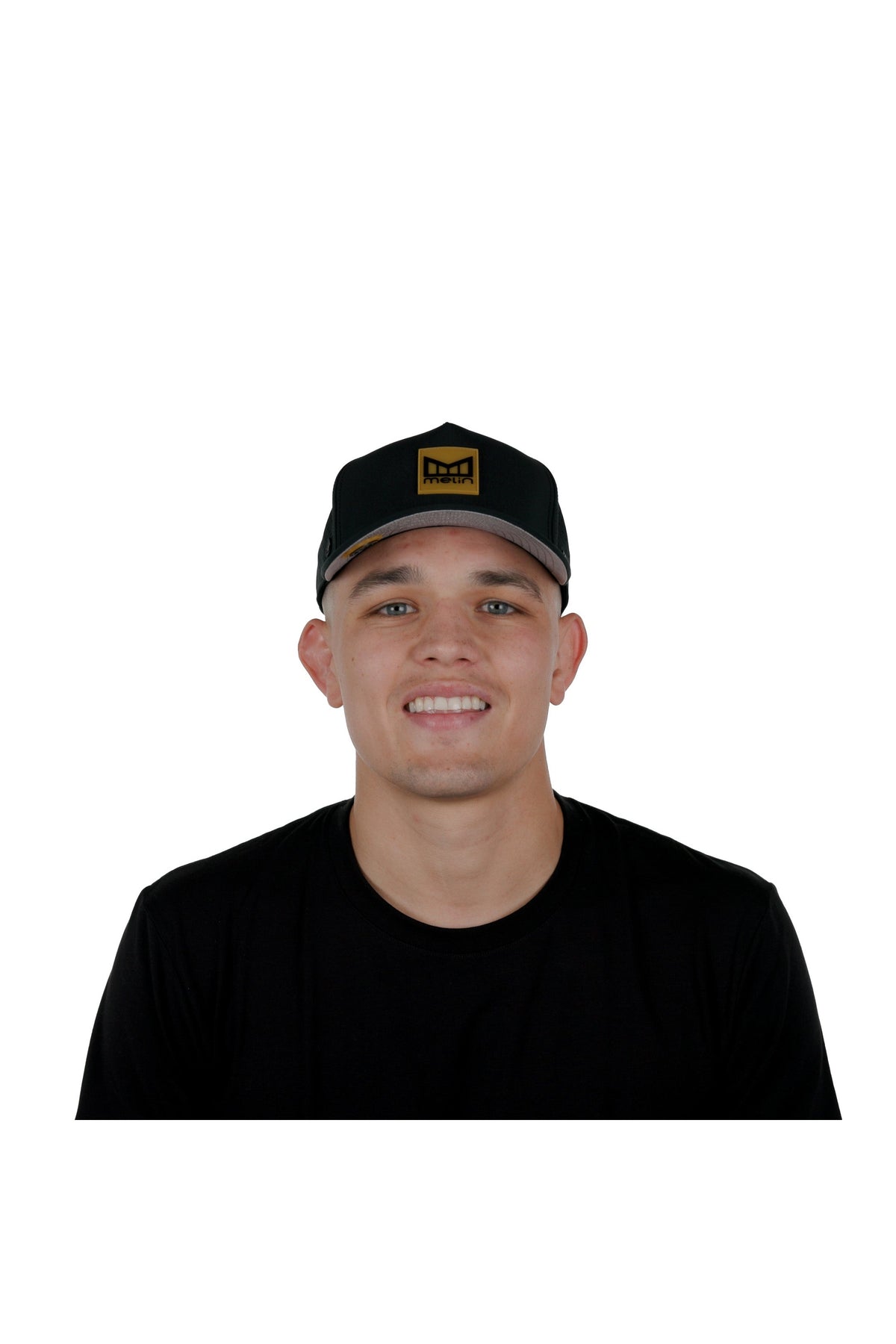 Model wearing the melin Odysea Stacked Hydro performance snapback hat in Black/Gum