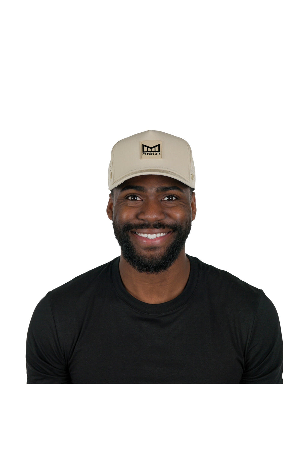 Model wearing the melin Odysea Stacked Hydro performance snapback hat in Khaki