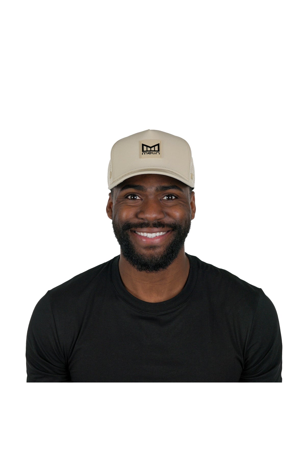 Model wearing the melin Odysea Stacked Hydro performance snapback hat in Khaki