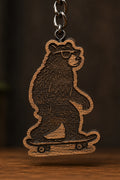Two Makers Crew Skateboarding Bear Keychain — Engraved bear wearing sunglasses and riding a skateboard