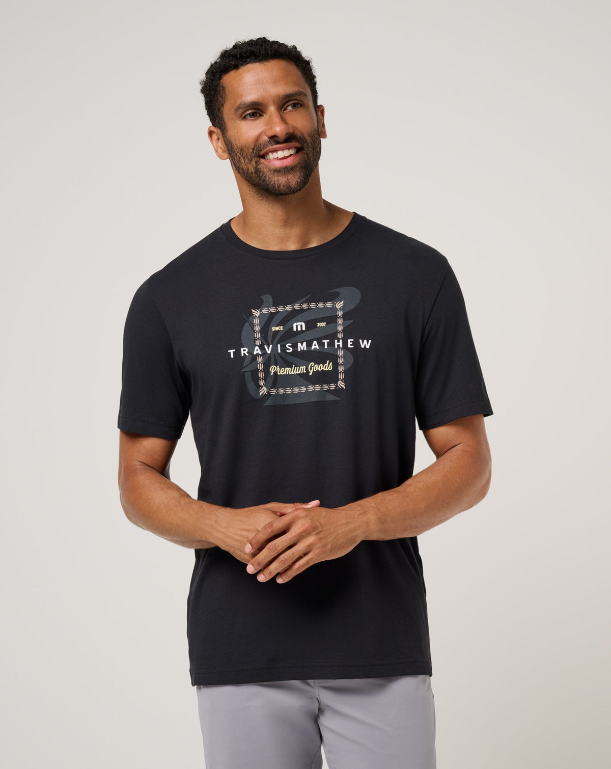 TravisMathew Good Investment Tee in Black men's graphic T-shirt front view
